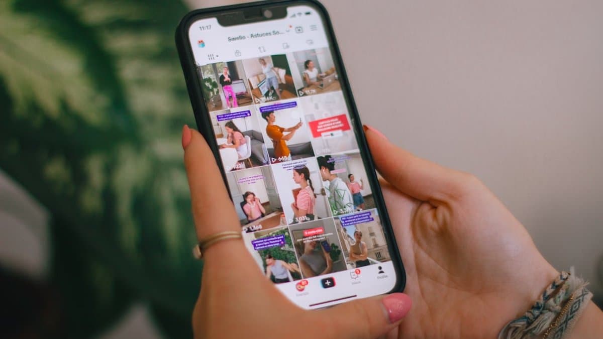 Mobile phone displaying short-form video content with optimized hook text, graphics, and visual hierarchy for maximum first-frame retention. — Photo by Swello on Unsplash