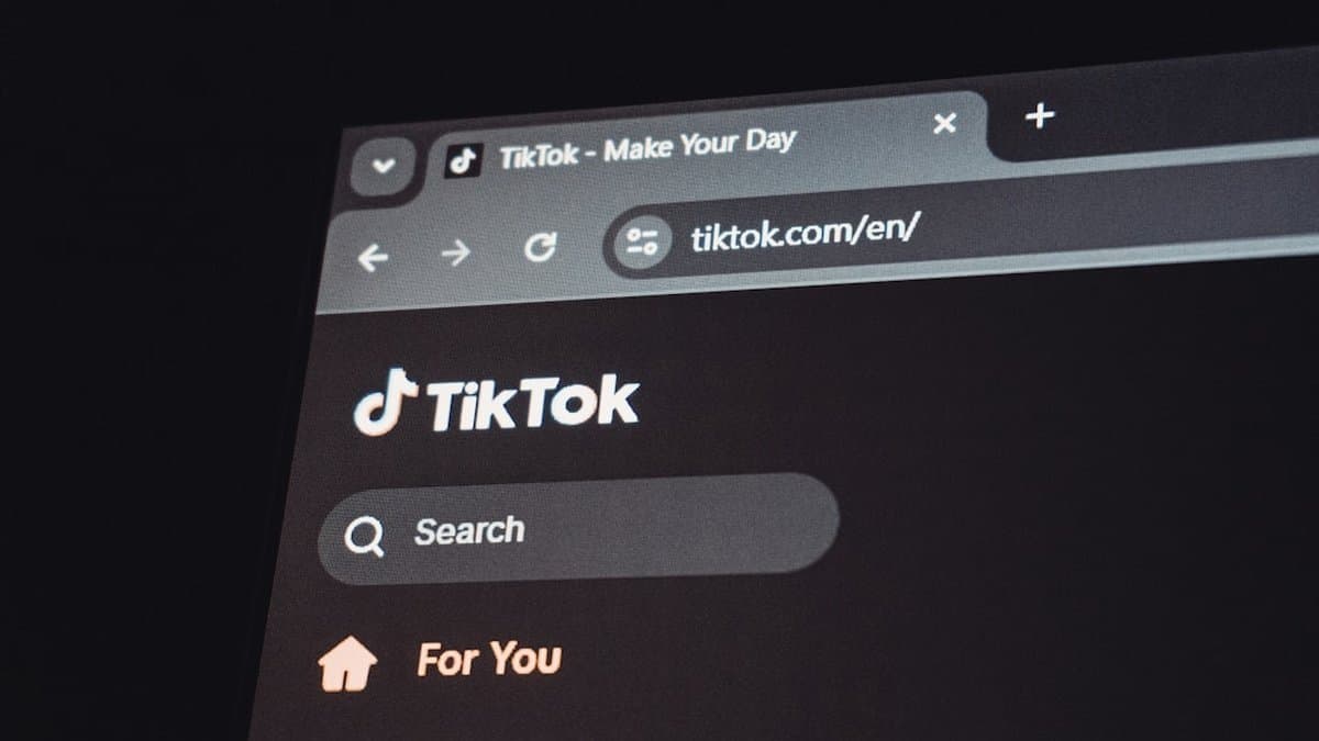 Creator setting up a TikTok Live broadcast with proper lighting and smartphone positioned for optimal camera angle and viewer engagement. — Photo by Zulfugar Karimov on Unsplash